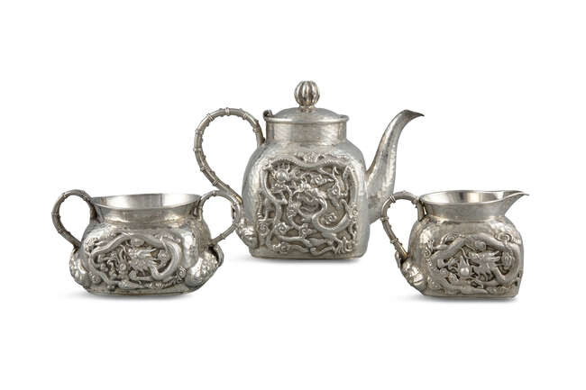 A ‘DRAGON’ CHINESE EXPORT SILVER THREE-PIECE TEA SET...