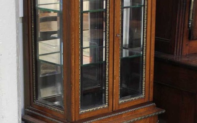 A French gilt metal mounted display cabinet