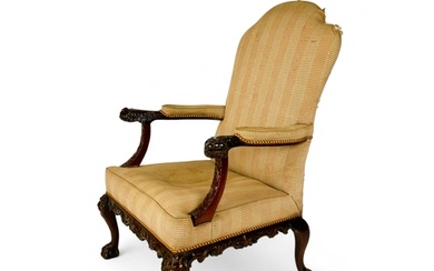 A George II carved mahogany library open arm chair In the m...