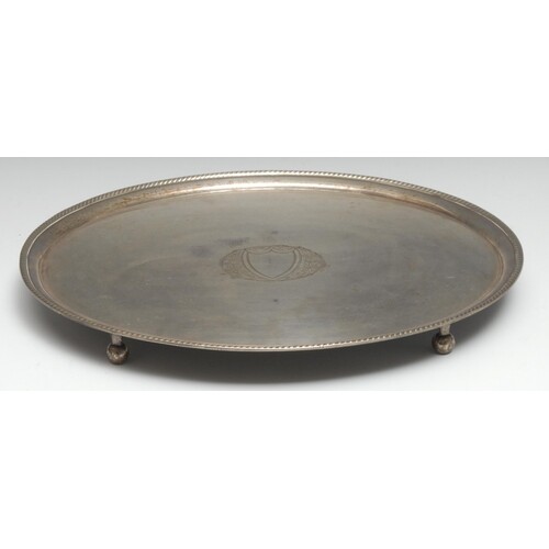 A George III Old Sheffield Plate oval tray, the field centre...