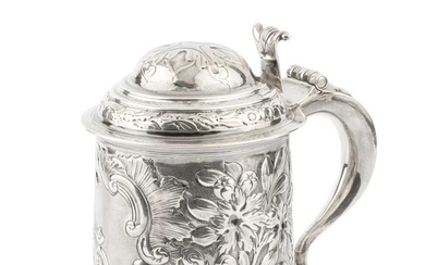A George III silver tankard, the girdled body and domed...