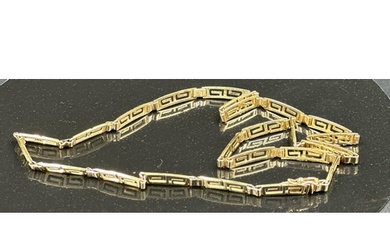 A Greek key designed necklace in yellow gold marked 585, wit...