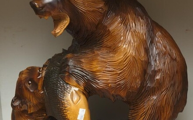 A JAPANESE CARVED WOODEN BEAR AND SALMON FIGURE, 44 CM HIGH