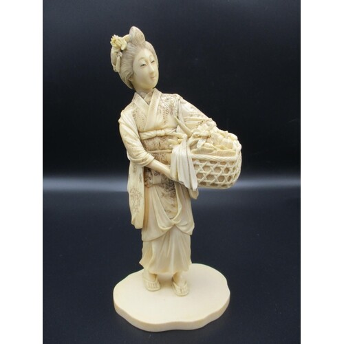A Japanese Meiji period ivory okimono, modelled as a woman i...