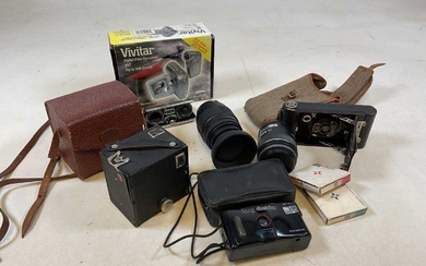 A Kodak folding camera, a cased Box Brownie, a Canon...
