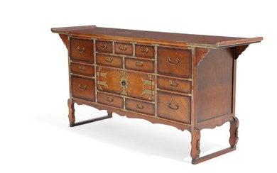 A Korean 20th century polished elmwood sideboard, front with two doors and several drawers. H. 81. W. 172. D. 46 cm.