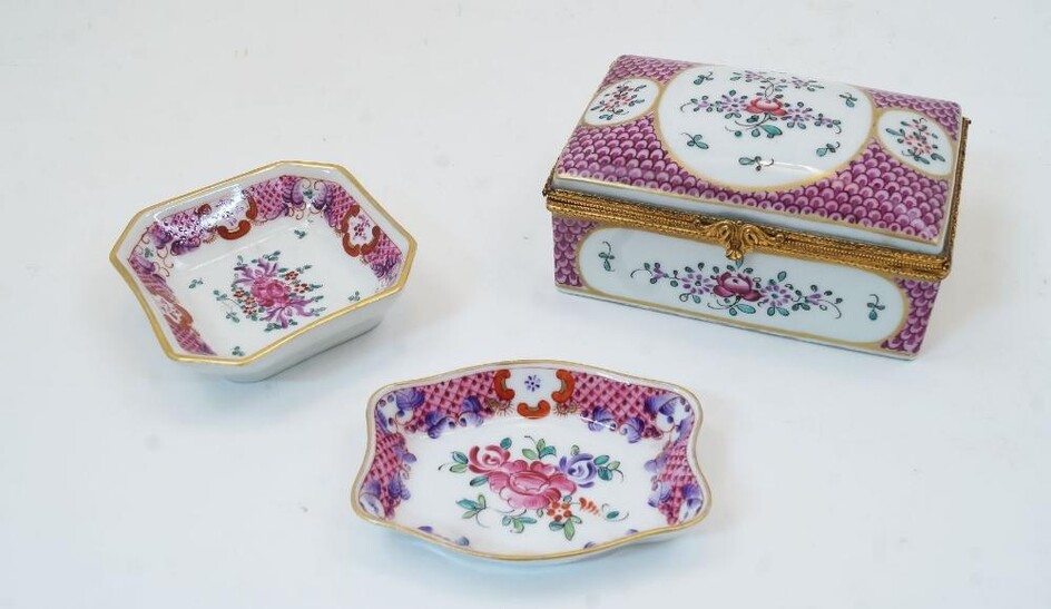 A Limoges porcelain gilt metal mounted box, 20th century, painted in pink fish scale pattern with cartouches of floral sprays, printed mark to base, 6.5cm x 13.5cm x 9cm, together with two Paris (La Courtille) style pin dishes, similarly decorated...