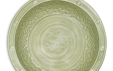 A Longquan celadon 'peony' charger, Yuan dynasty 元 龍泉青釉牡丹紋折沿盤