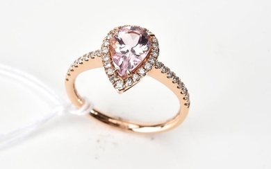 A MORGANITE AND DIAMOND RING IN 18CT ROSE GOLD, THE PEAR CUT MORGANITE WEIGHING1.05CTS, SIZE M, 3.3GMS
