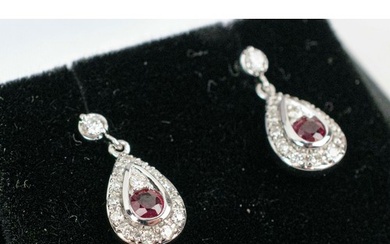 A PAIR OF 18CT WHITE GOLD RUBY AND DIAMOND PENDANT EARRINGS,...