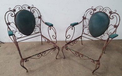 A PAIR OF DECORATIVE WROUGHT IRON ARMCHAIRS