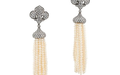 A PAIR OF DIAMOND AND PEARL DAY TO NIGHT TASSEL EARRINGS each comprising a fleur de lis motif set
