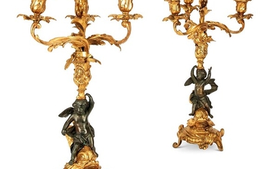 A PAIR OF FRENCH GILT AND PATINATED BRONZE CANDELABRA