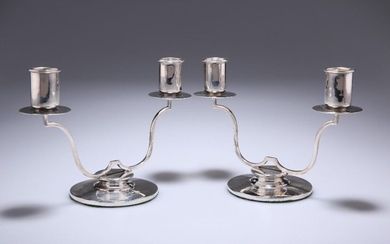 A PAIR OF GEORGE VI SILVER TWO-LIGHT CANDELABRA...