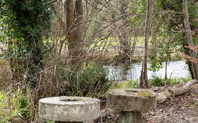 A PAIR OF HEAVY MILL WHEEL TOPPED STADDLE STONE TABLES, LATE 18TH/EARLY 19TH CENTURY