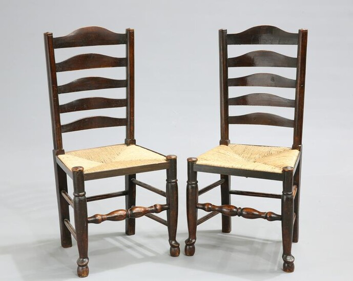 A PAIR OF LANCASHIRE RUSH-SEATED OAK LADDER-BACK SIDE
