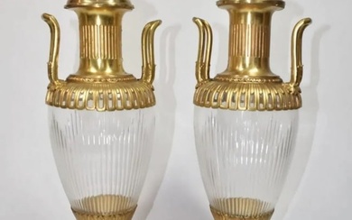 A PAIR OF ORMOLU MOUNTED CUT CRYSTAL VASES AND COVER