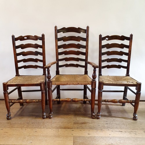 A pair of early 20th century oak hall chairs, another pair,...