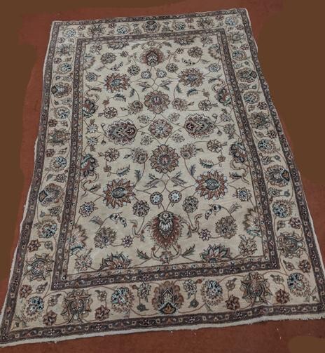 A Persian camel fur rug with blue stylised decor, 240 x