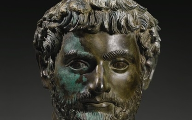 A ROMAN BRONZE PORTRAIT HEAD OF A MAN, HADRIANIC, CIRCA EARLY 2ND CENTURY A.D.