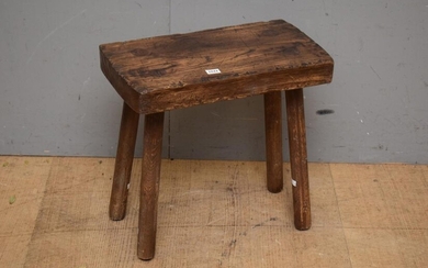 A RUSTIC FRENCH STYLE OAK STOOL (39H x 42W x 23D CM) (LEONARD JOEL DELIVERY SIZE: SMALL)