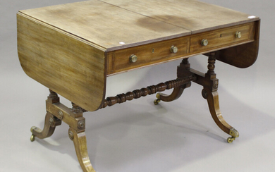A Regency mahogany sofa table, the reeded edge top above two opposing drawers and dummy drawers, rai