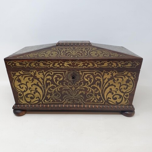 A Regency rosewood and brass inlaid tea caddy, sarcophagus f...