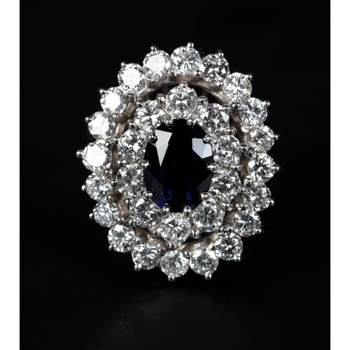 A SAPPHIRE AND DIAMOND CLUSTER RING in 18ct white gold claw ...