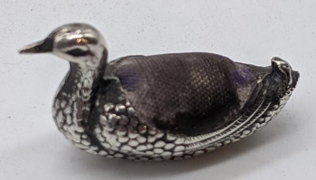 A Sampson Mordan & Co silver duck pin cushion
