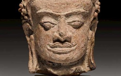 A TERRACOTTA HEAD OF BUDDHA.