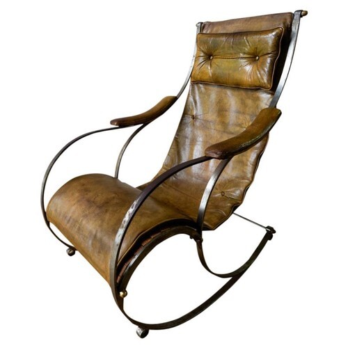 A VICTORIAN STEEL AND LEATHER UPHOLSTERED ROCKING CHAIR BY R...