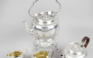A Victorian Scottish silver four piece tea service including a spirit kettle on matched stand.