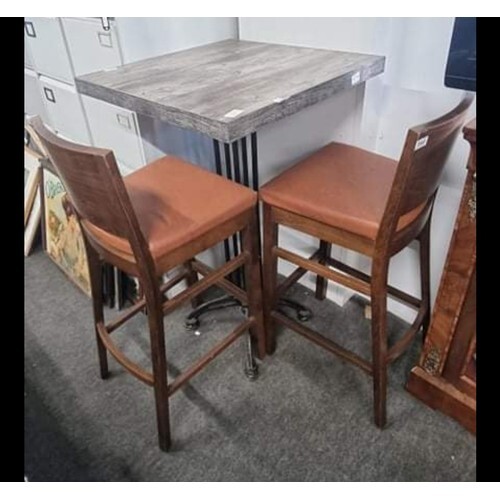 A bar table with cast iron base & pair of bar stools.