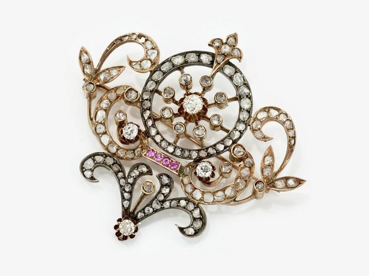 A brooch with diamonds and rubies
