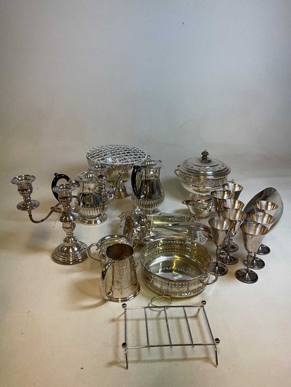 A collection of silver plate including a Viners twin handled...