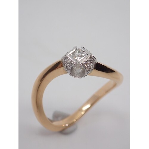 A diamond cluster ring set in 18ct gold, total estimated wei...