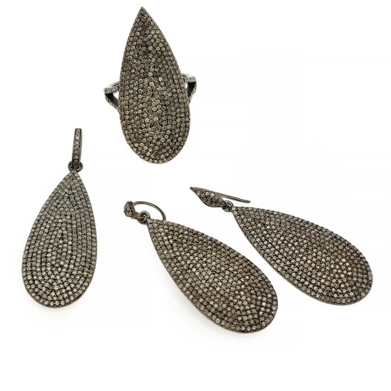 A diamond jewellery set comprising a ring, a pair of ear pendants and a pendant each set with numerous single-cut diamonds, mounted in sterling silver.
