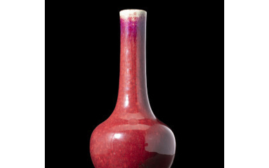 A flambè red glaze bottle vase, on wood base (slight defects) China, 19th century (h. 25 cm.)