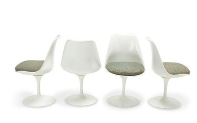 A group of Eero Saarinen-style tulip chairs