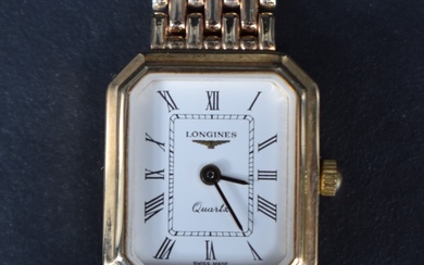 A ladies 9ct gold wrist watch by Longines, the white dial with Roman numerals, having a personalised