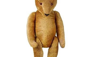 A large early 20th century straw filled teddy bear, circa 19...