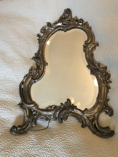 A late 19th century silver plated Rococo style table mirror. H. 44 cm. W. 28 cm.