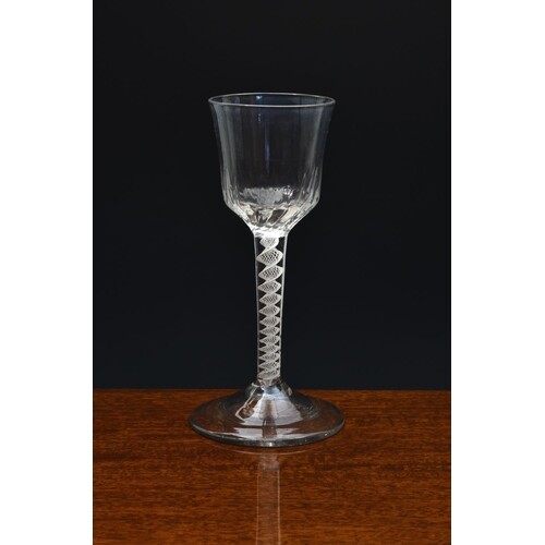 A mid-18th century wrythen moulded airtwist wine glass, c.17...
