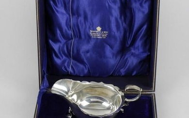 A pair of Edwardian silver sauce boats, each of typical