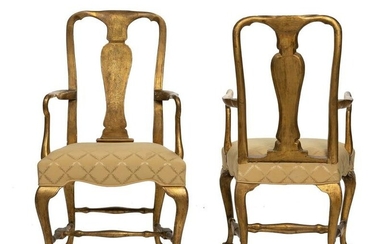 A pair of English Queen Anne carved giltwood armchairs