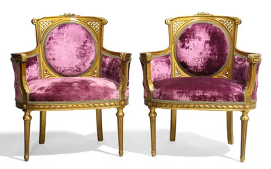 A pair of French giltwood salon chairs, of Louis XVI style, second...