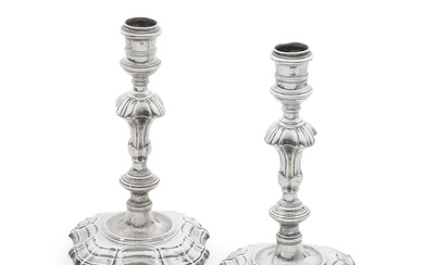 A pair of George II cast silver candlesticks Thomas Gilpin,...