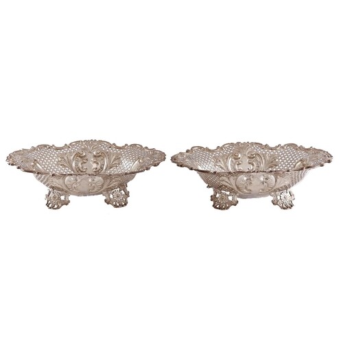 A pair of Victorian die stamped and pierced silver sweetmeat...