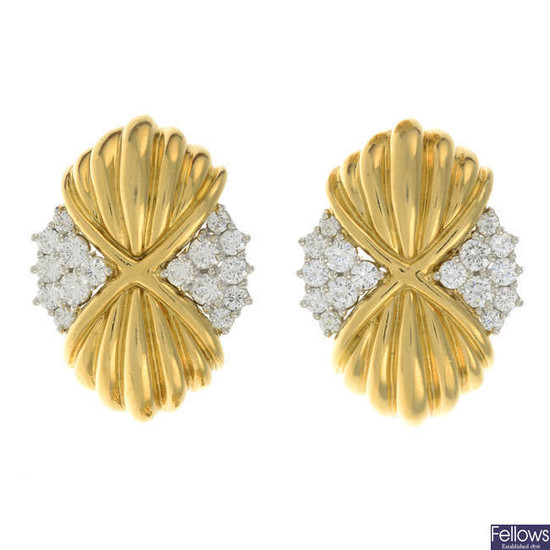 A pair of brilliant-cut diamond and grooved earrings.
