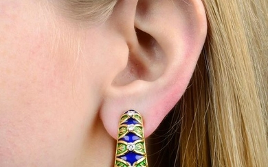 A pair of diamond and enamel hoop earrings.Estimated